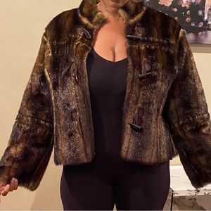 Beautiful, soft faux fur coat with leather interior, zipper.